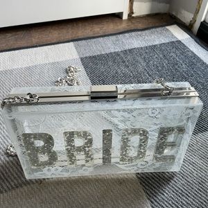 Aldo Acrylic Clear Bride Clutch/Chain Bag with Lace Pattern.